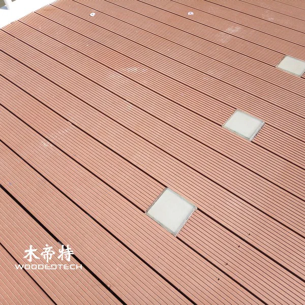Tongue and groove composite decking creates seamless outdoor flooring with easy installation