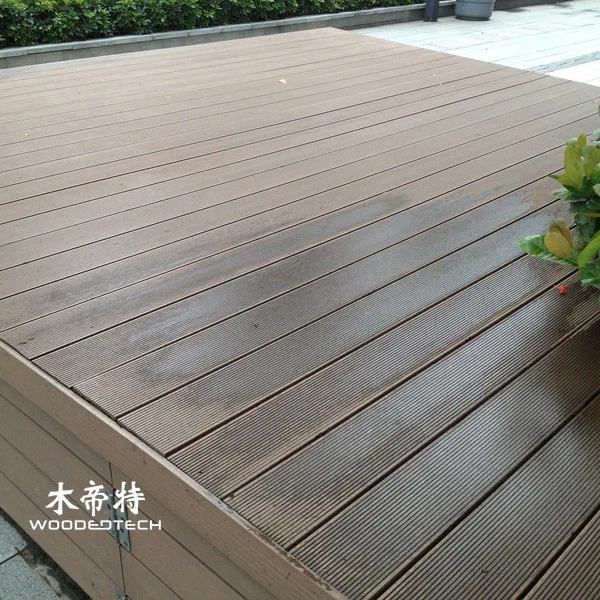 ground level composite deck provides a comfortable outdoor space with easy maintenance benefits